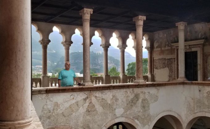 Chef Dennis standing on a walkway at Buonconsiglio Castle