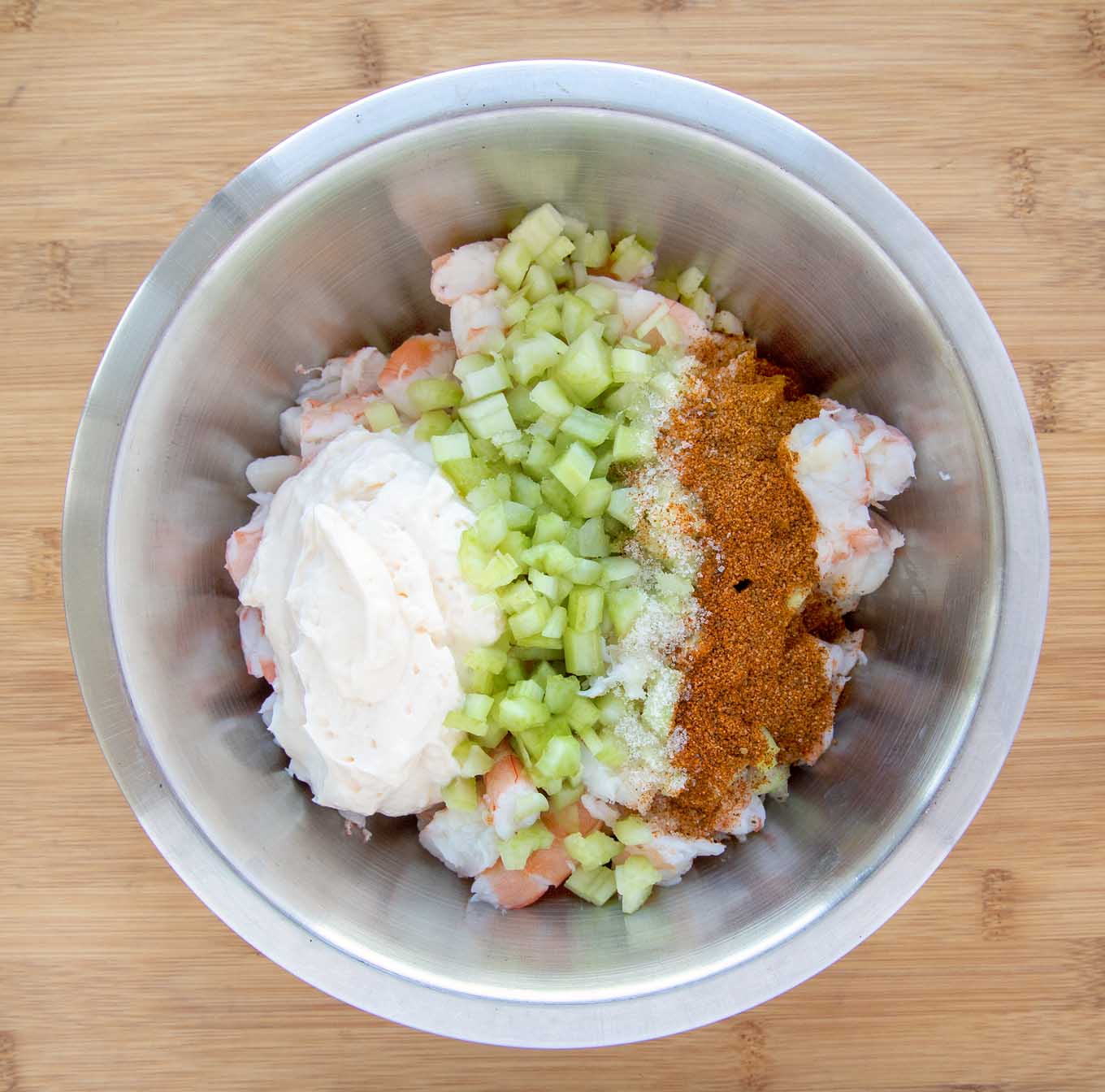 Ingredients in a stainless steel bowl before mixing.