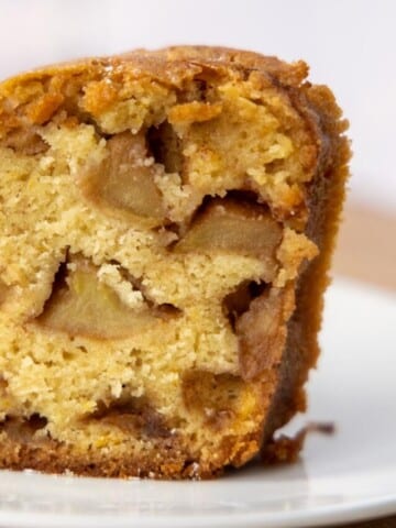 slice of Jewish apple cake on a white plate