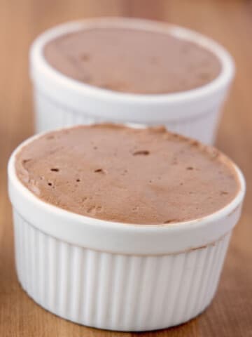 chocolate mousse in four white ramekins