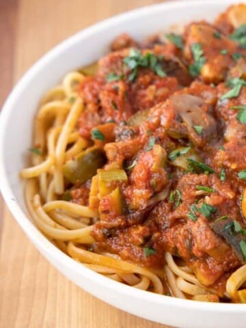 vegetarian sauce over pasta in a white bowl