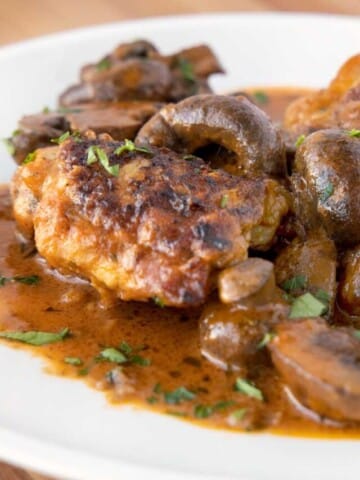 chicken chasseur on a white plate