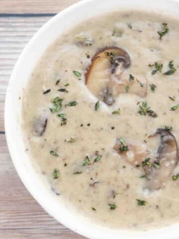 cream of mushroom soup in white bowl.