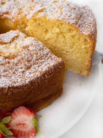 Slice being taken out of whole chiffon cake.