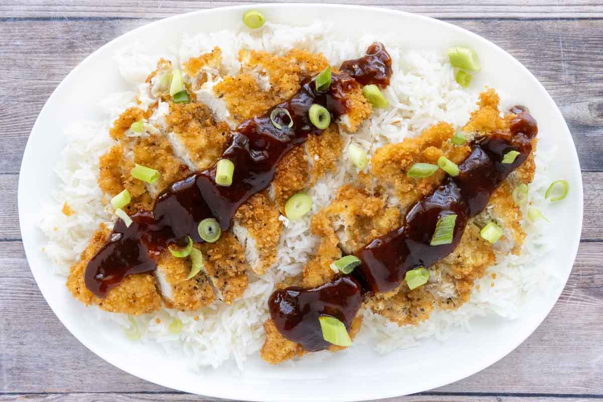 Katsu Chicken served over white rice with tonkatsu sauce.