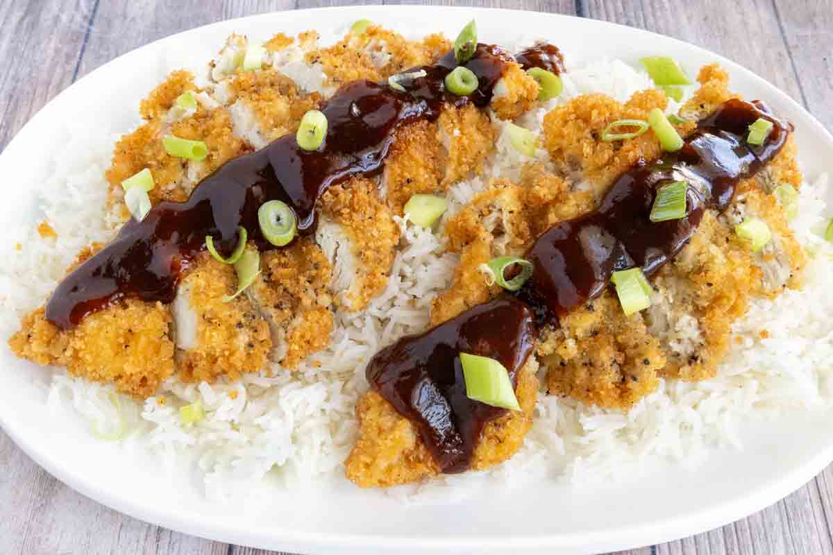 Katsu Chicken served over white rice with tonkatsu sauce.