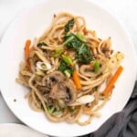 Yaki Udon stir fry on a white plate.