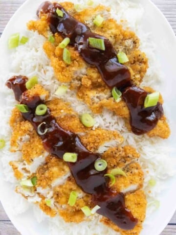 Katsu Chicken served over white rice with tonkatsu sauce.