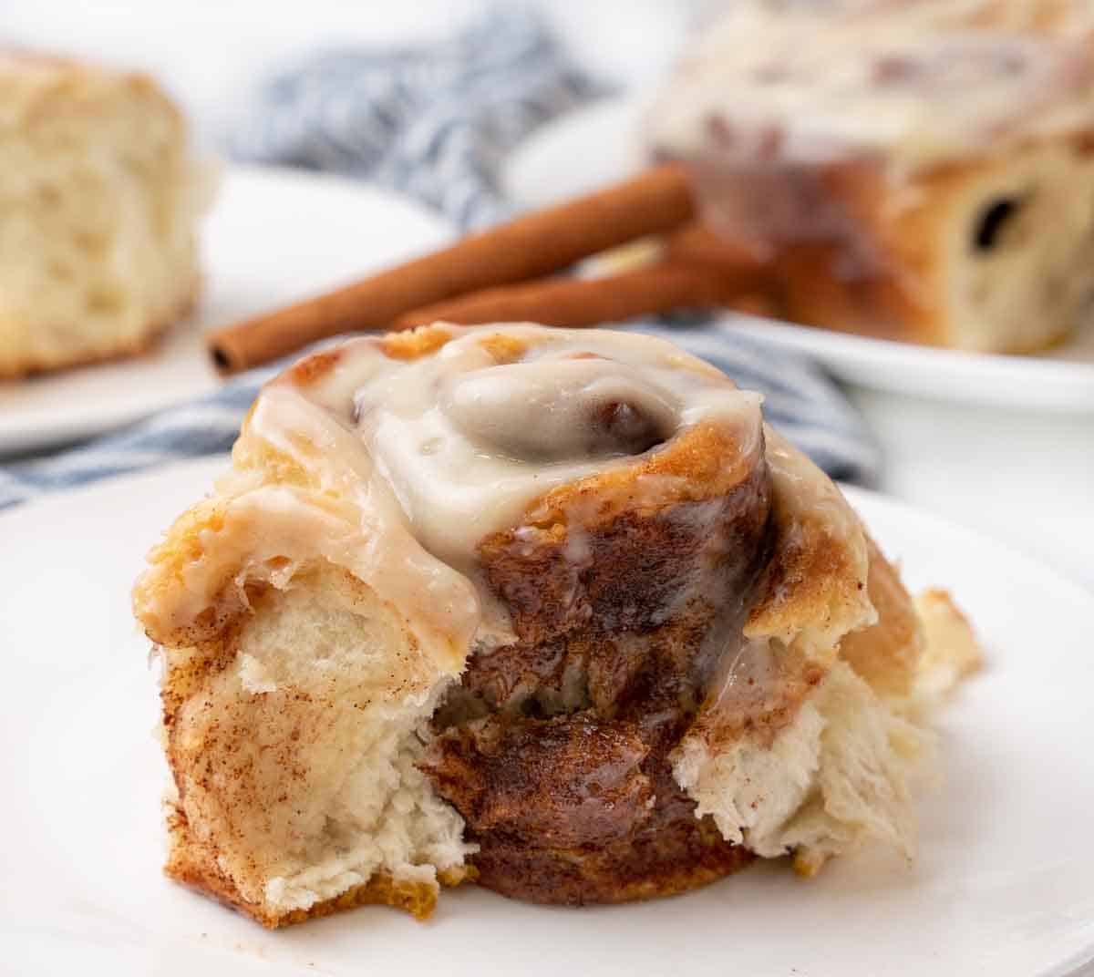 easy cinnamon roll on a white plate.