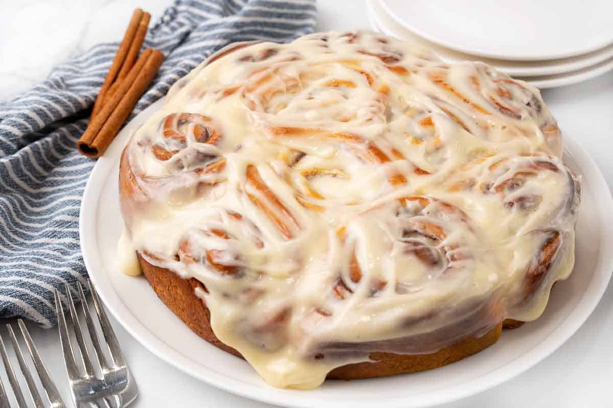 Whole pan of easy cinnamon rolls on a white platter.