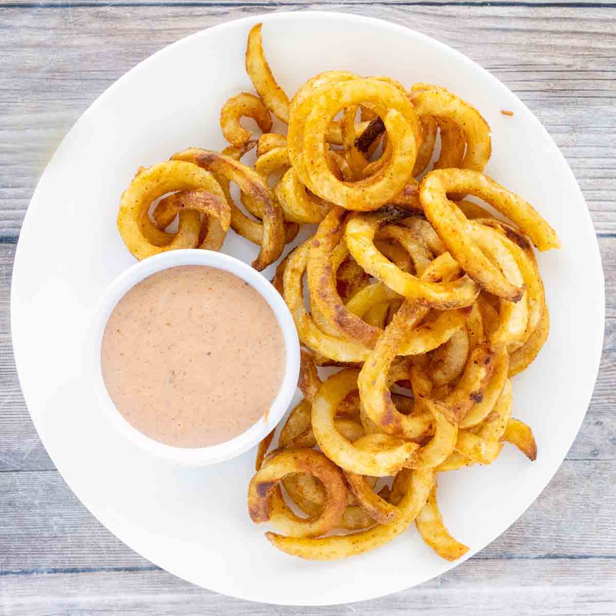 Comeback sauce with curly fries.