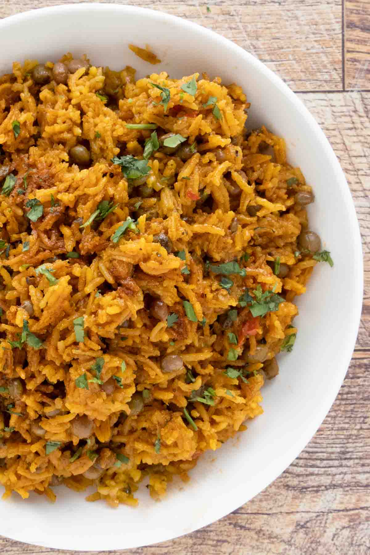 Arroz con Gandules (Puerto Rican rice) in a white bowl.