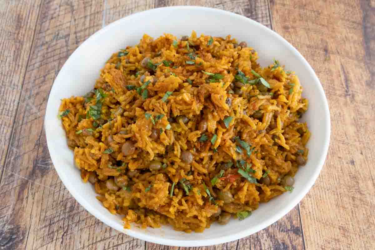 Arroz con Gandules (Puerto Rican rice) in a white bowl.