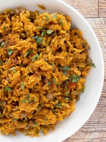 Arroz con Gandules (Puerto Rican rice) in a white bowl.