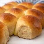 Hawaiian dinner rolls on parchment paper.