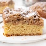 Slice of crumb cake on a white plate.