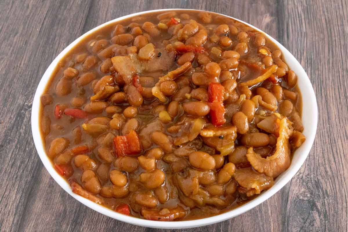 Baked beans in a white bowl.