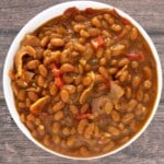 Baked beans in a white bowl.