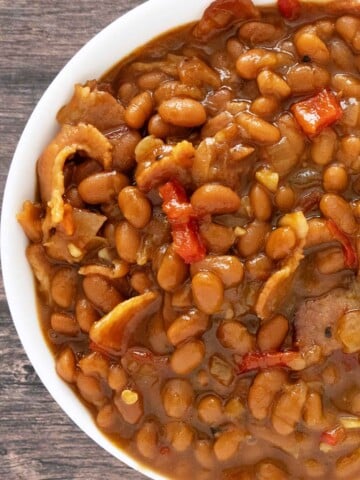 Baked beans in a white bowl.