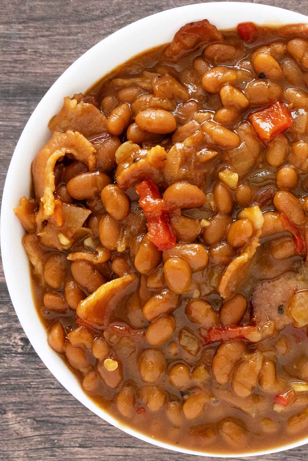 Baked beans in a white bowl.