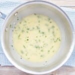 Beurre blanc sauce in a frying pan.