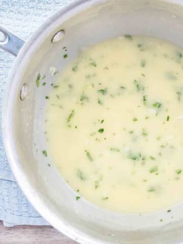 Beurre blanc sauce in a frying pan.