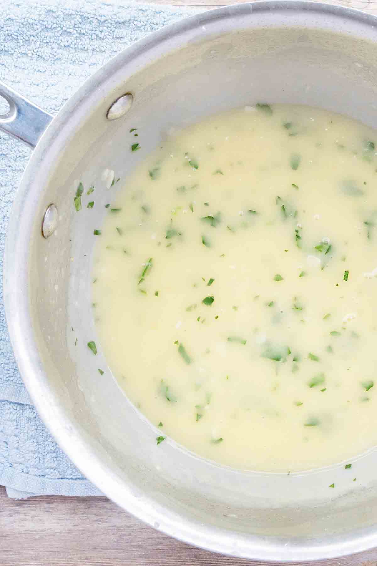 Beurre blanc sauce in a frying pan.