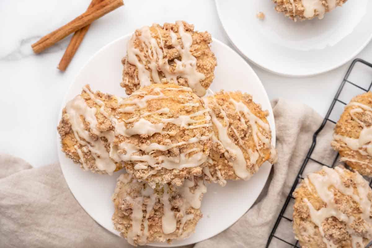 Coffee cake muffins on a white plate.