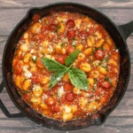 Gnocchi alla sorrentina in a cast iron pan.