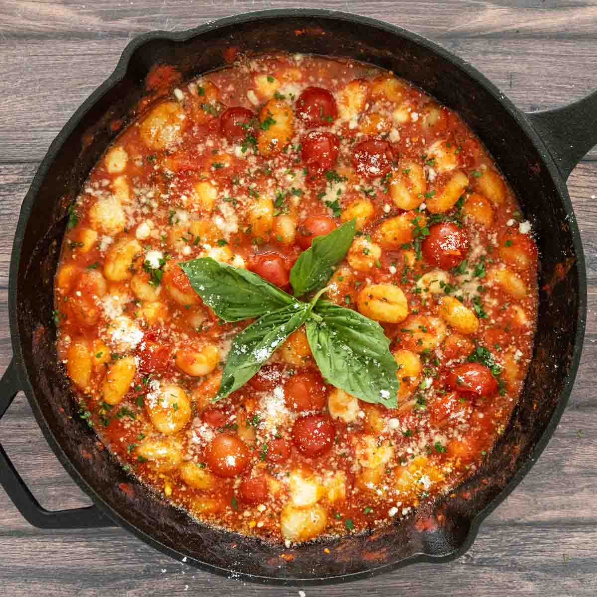 Gnocchi alla sorrentina in a cast iron pan.