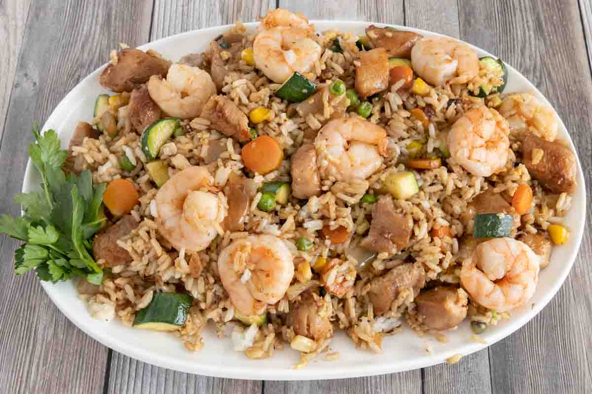 Shrimp and Chicken Fried Rice on a white platter.