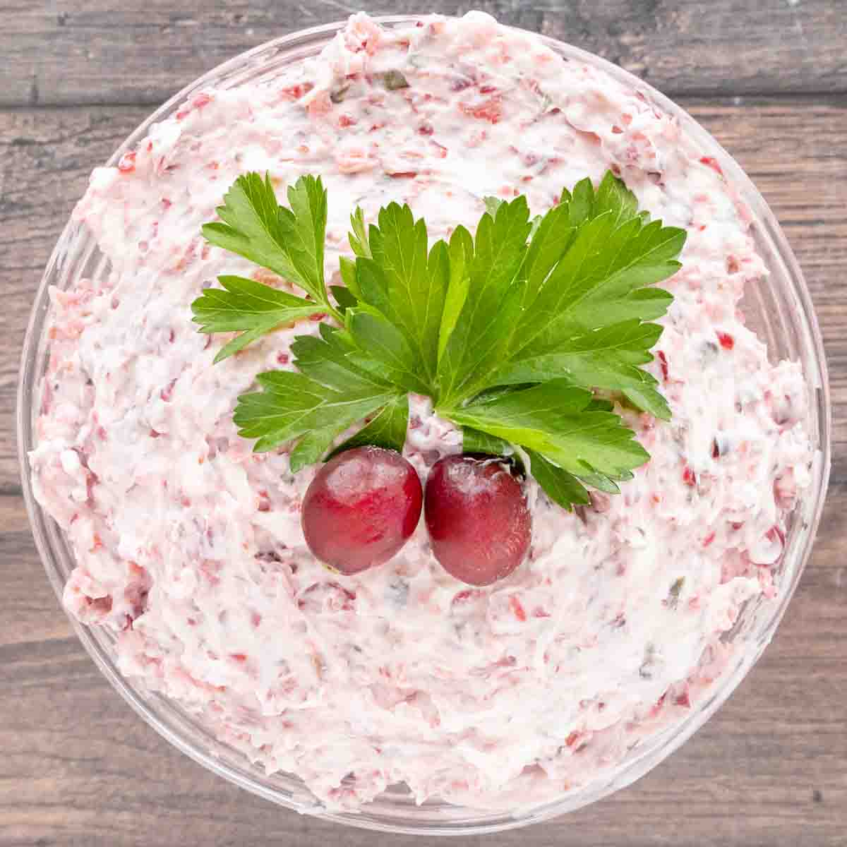 Whipped Cranberry Jalapeno dip in a glass bowl.